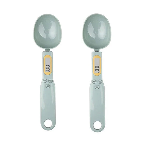 Shoppikala digital measuring spoon and kitchen scale showing 500g capacity with LCD display, used for precise food measurements.
