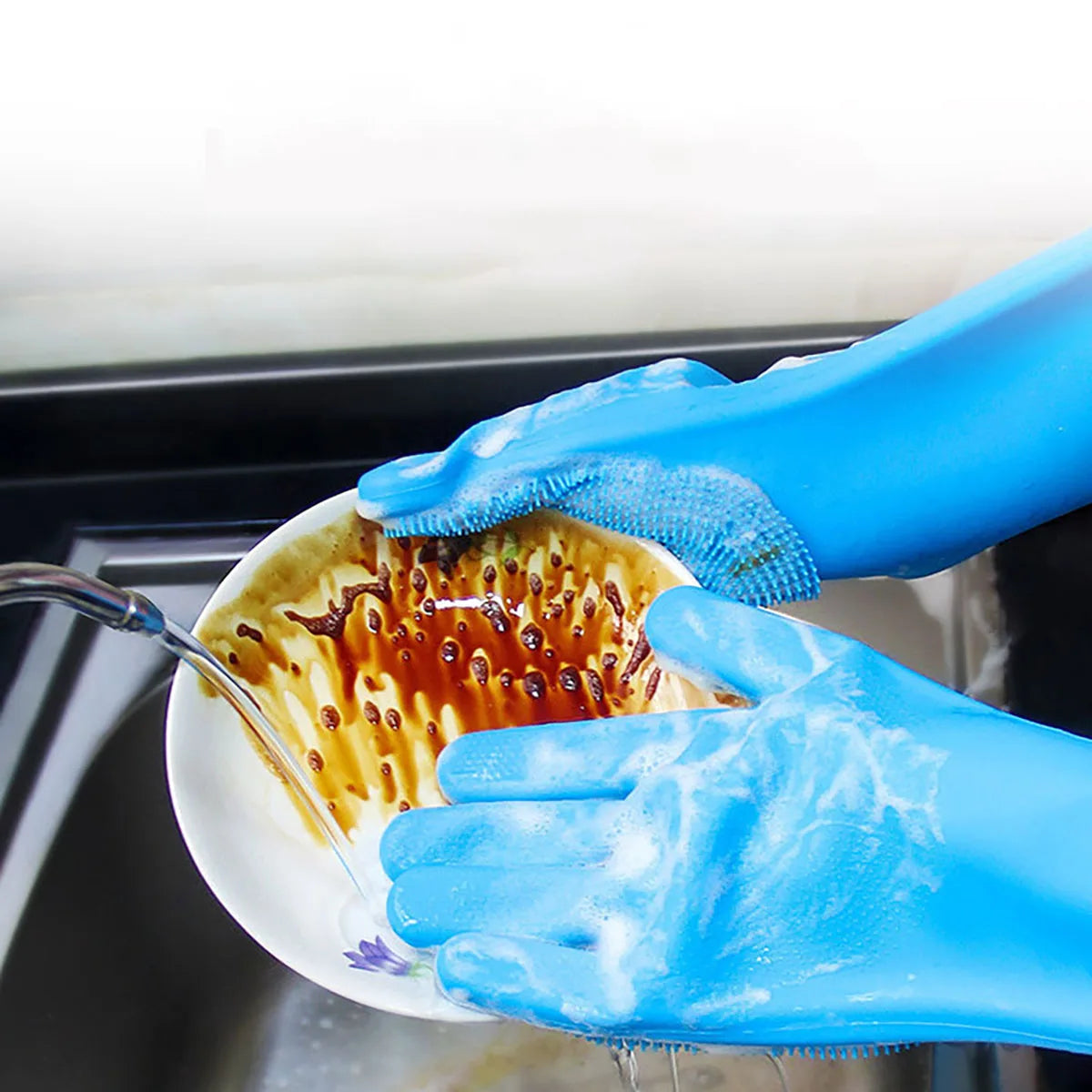 Shoppikala silicone dishwashing gloves with built-in scrubber for kitchen cleaning, shown in use with soapy water.