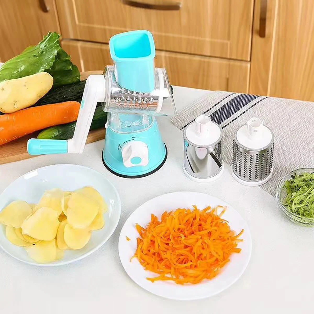 Shoppikala multifunctional vegetable slicer and shredder with three sharp drums for grating cheese, vegetables, and nuts manually.